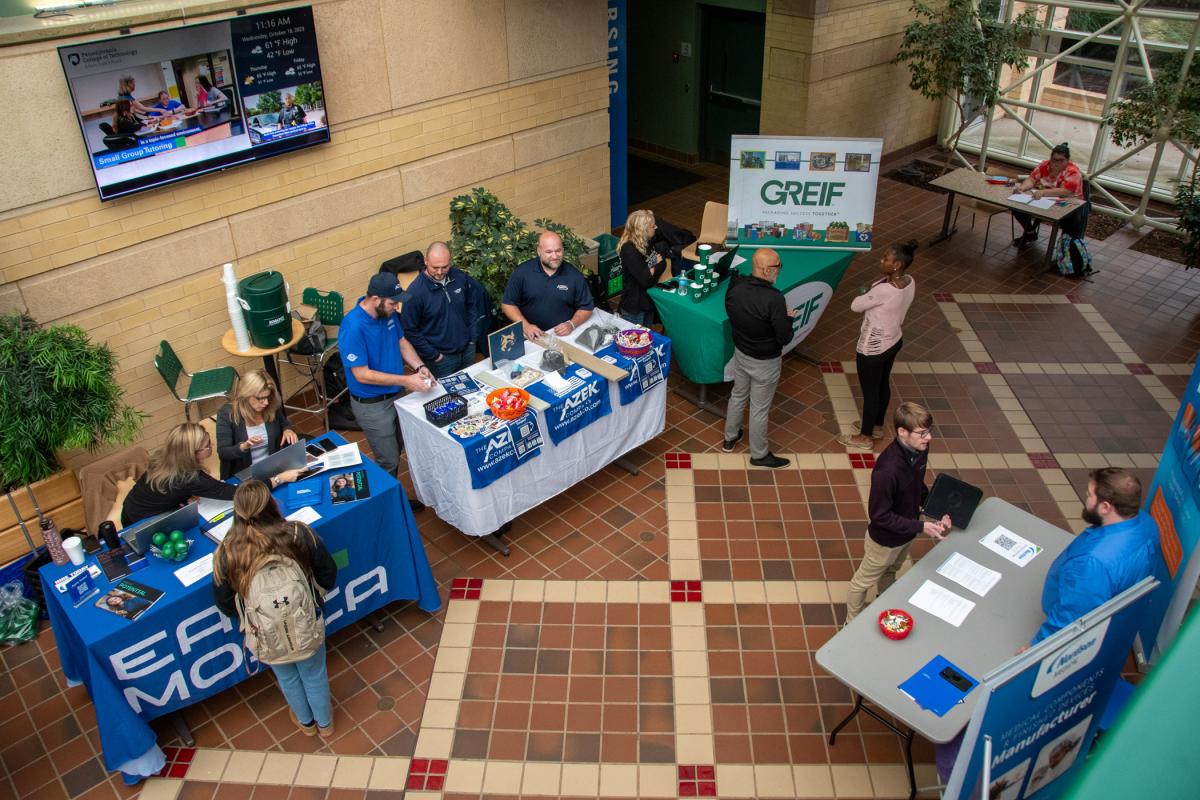 Plastics students and employers interact in the ATHS atrium.