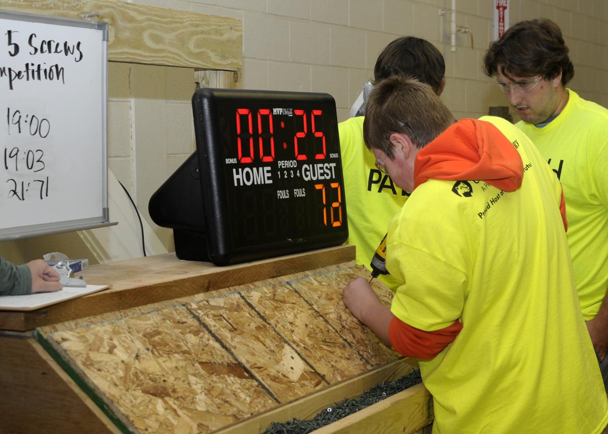 A South Williamsport student takes drill in hand, making every second count at a West Branch Susquehanna Builders Association attraction. The safety glasses were supplied by Construction Specialties which, while having to cancel at the last-minute, nontheless donated 1,000 pairs!