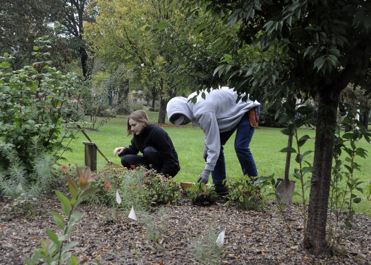 Planting blanket flowers on the Maynard Street side of the park are landscape/plant production technology students Diane Y. Saylor, of Pennsylvania Furnace, and Brandon C. Wolfe, of Albion.