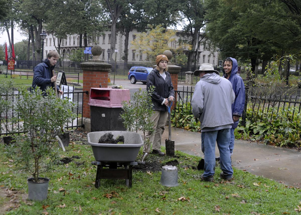 Bower, an assistant professor of horticulture, offers pointers and encouragement to students edging – as well as planting bayberry and amsonia – along West Fourth Street. From right are Saudiah Wells, of Williamsport, and Lila A. McKeon, of Montoursville, both enrolled in landscape/plant production technology; and McKeon's spouse, Gabriel. (Gabriel McKeon holds an associate degree in metal fabrication technology and is pursuing a bachelor's in applied management.)