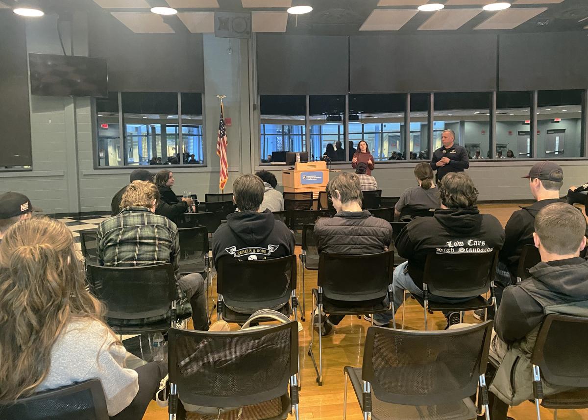 Penn College Police Chief David C. Pletz (assisted by Casey Thurber, a contracted American Sign Language interpreter) talks with students at Wednesday's Town Hall.