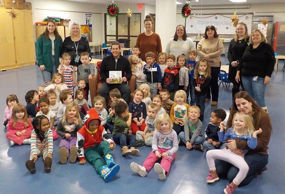 Book-loving Birds join author Tom Speicher and staff of the Children's Learning Center for story time on Thursday morning.