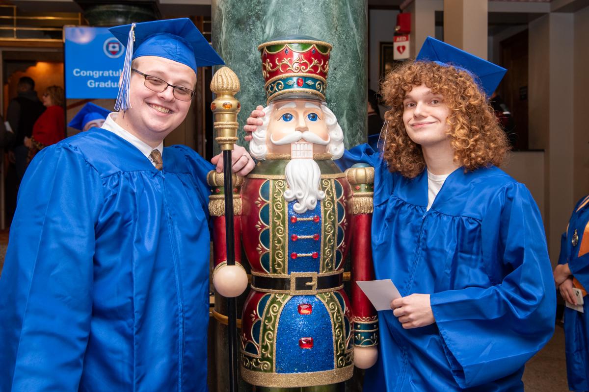 In the venue’s lobby, this seasonal “guardian” makes a favorite photo op for many a visitor, including culinary arts technology grads Gunner T. Vuocolo (left) and Jordan S. Brouse.
