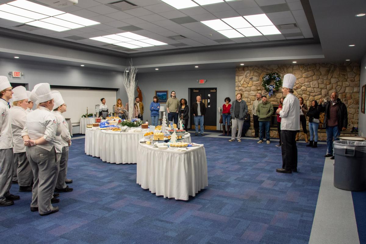 Before high school visitors arrive, Niedermyer welcomes students’ families to the Grand Pastry Display.