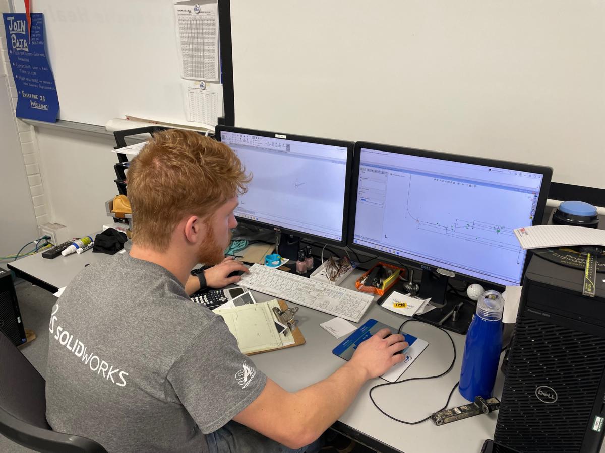 Marshall W. Fowler, of Sellersville and majoring in engineering design technology, works on the car’s design.