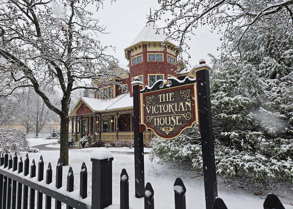 Still-falling flakes enhance the beauty of The Victorian House.