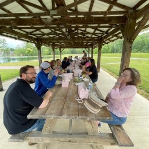 Deans' Council enjoys an outdoor lunch in scenic surroundings.