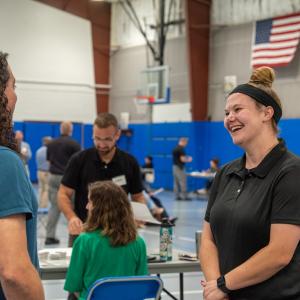 Human services alumna and bail release officer Bryssa A. Dunkleberger (right) enjoys conversation with Miller, her former professor.