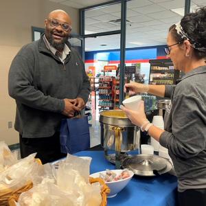 Denise M. Gardner-Butler, dining services worker, ladles out a bowl of chicken tortilla soup for Chuck D. Crews Jr., assistant director for secondary partnerships. (Cheddar broccoli soup was also on the takeout menu.)