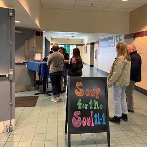 Participants check in for the event and learn whether they were the lucky recipient of a handcrafted bowl.