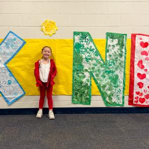 child at Kind sign