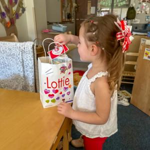 child with Valentine's bag