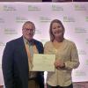 Laura A. Snyder, of Harrisburg, a landscape/plant production technology student at Pennsylvania College of Technology, celebrates her $1,000 National Association of Landscape Professionals Foundation scholarship with Carl J. Bower Jr., assistant professor of horticulture. 