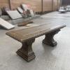 Concrete benches, straight and curved, are among the items for sale.