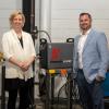 Elizabeth A. Biddle (left), senior corporate relations director at Pennsylvania College of Technology, and Max Williams, manager, national distribution sales for Hypertherm, are seen in a Penn College welding lab with a Hypertherm Powermax105 SYNC® plasma system unit, one of 10 units entrusted to the college by the manufacturer. 