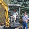 Under the trained eye of Kenneth J. Bashista, laboratory assistant for diesel equipment technology, Kimberly S. Cordrey takes the controls of a mini-excavator. Cordrey is the Lumley Aviation Center secretary.
