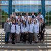 The bachelor’s degree nursing major’s May graduating class gathers in front of their Breuder Advanced Technology & Health Science Center home base.