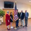 Placing the colors in the lobby of Penn College’s Student & Administrative Services Center – home to the Major General Fred F. Marty, USA Retired, Veterans and Military Resource Center – are (from left) President Davie Jane Gilmour; Teagan Marty, wearing her grandfather’s dog tags; ROTC Cadet Austin S. Weinrich, a residential construction technology and management: building construction technology concentration student from Jenkintown; state Sen. Gene Yaw, chair of the college’s board 