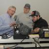 Joe Sweeney (center) and David M. Zajac Jr. watch a demonstration by instructor Thomas W. Fry during their "Mechatronics Day" visit to Penn College.