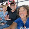 Kimberly S. Cassell (right), college relations director, takes an in-the-stands snapshot with John and Janice Urick. John is a 1974 forest technology grad of Williamsport Area Community College, as proudly reinforced by his choice of headgear.