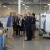 Instructor John M. Good leads a tour of Pennsylvania College of Technology’s automated manufacturing lab for a group that includes Patrick T. Harker, president and CEO of the Federal Reserve Bank of Philadelphia. 