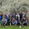 With shovels showing the signs of their work, the group gathers at Trailing Pines Tree Farm. 