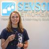 Pennsylvania College of Technology graduate Natalie J. Rhoades, a native of Weedville, holds the SensorScan DHT-400 ultrasonic transducer, which she recently designed for Sensor Networks Inc. 