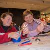 Debra Lindner and David Lentz, both technology teachers at Sullivan County High School, assemble a rubber-band powered glider as they practice hands-on lessons they can use in their classes to help students practice creative problem solving and prepare them for potential careers in science, technology, engineering and math fields. 