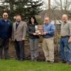 Partners in Penn College's ongoing status as a national Tree Campus mark the designation outside the Schneebeli Earth Science Center, home to the institution's landscape/horticulture technology and forest technology majors.