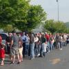 A line of job-seekers stretches from the Field House entrance and across the parking lot.