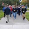 Student Ambassador Brent K. Hey leads a tour group past the Hager Lifelong Education Center.