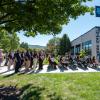 Students, special guests and employees gather outside the Physician Assistant Center at Pennsylvania College of Technology to hear remarks by Joshua A. Bower (at podium at right), director of the physician assistant program, at the start of an open house celebrating recent renovations to the center. 