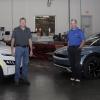 Among faculty members at the forefront of educating tomorrow's electric-vehicle technicians – and standing between two 2023 all-electric vehicles in a Pennsylvania College of Technology lab – are Charles F. Probst (left), the automotive instructor for the college's new three-credit Electric & Hybrid Vehicle Technology course, and Christopher J. Holley, assistant professor of automotive.