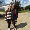 A mother and daughter on a mission, happily stop on the campus mall to oblige a photographer.