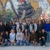 Students gather before the mosaic that was installed on the Physician Assistant Center by students and faculty to mark the college’s centennial in 2014.