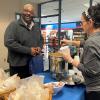 Denise M. Gardner-Butler, dining services worker, ladles out a bowl of chicken tortilla soup for Chuck D. Crews Jr., assistant director for secondary partnerships. (Cheddar broccoli soup was also on the takeout menu.)