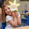 A child shows off her handiwork in Pennsylvania College of Technology’s Dunham Children’s Learning Center. The center received a Child Care Access Means Parents in School grant from the U.S. Department of Education to help lower child care costs for eligible students, based on income.