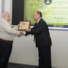 James E. Doebler receives his award from the FAA's John Sibole.