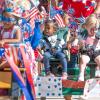 children in parade on campus