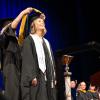 graduate receives her master's degree hood