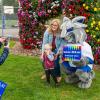 a mother and son pose with the college Wildcat