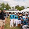 Little league team pose with mascots