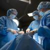 three students in a surgical technology lab