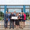 group photo with large check