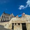 Students hold a Penn College banner near a historic building in Budapest