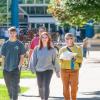 a family walks on the campus mall during Open House