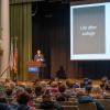 keynote speaker addressing conference crowd