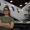 Lauren Peck standing in front of airplane