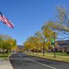 American flag at college entrance