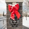 snowy red bow at college entrance